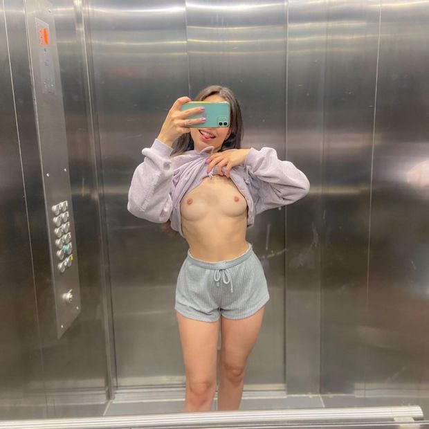 Brunette teen flashes tits in elevator