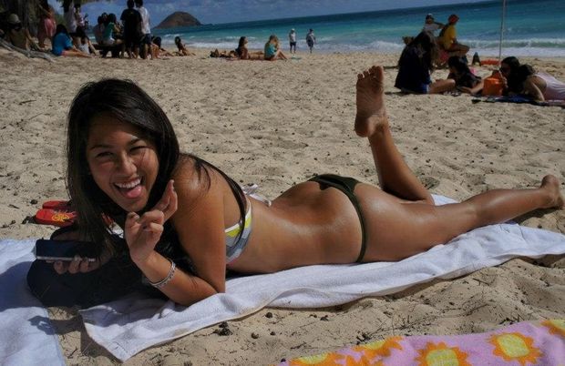 Sexy asian chick tanning