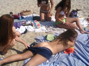 teen stripped by friend on beach