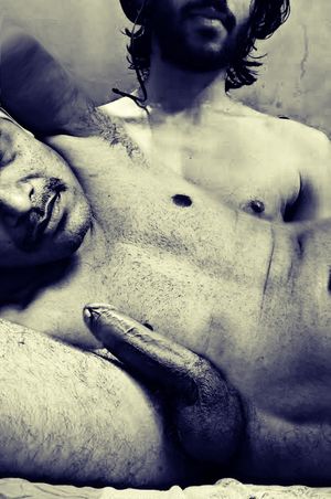 Lying on his lap and staring at his big cock is Bliss