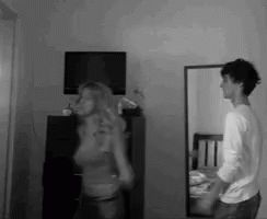 B&W grabs and kisses her