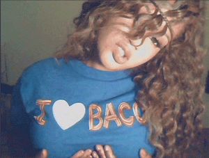 Raychiel cupping her boobs