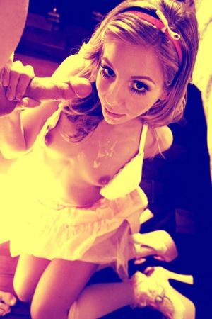 Adorable redhead dressed up and giving head