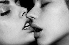 Babes with dark features making out.