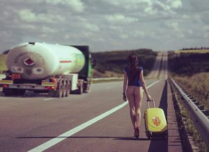 Bottomless brunette traveling