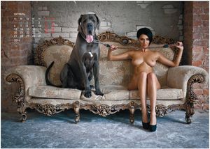 Busty brunette with her dog on the couch