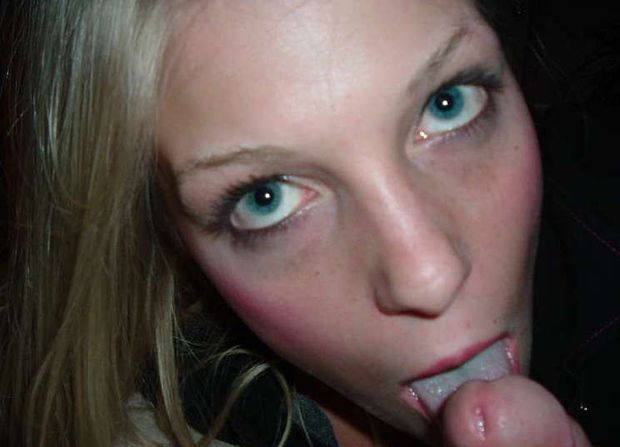 Lovely blue-eyed blond teen giving a cock a lick