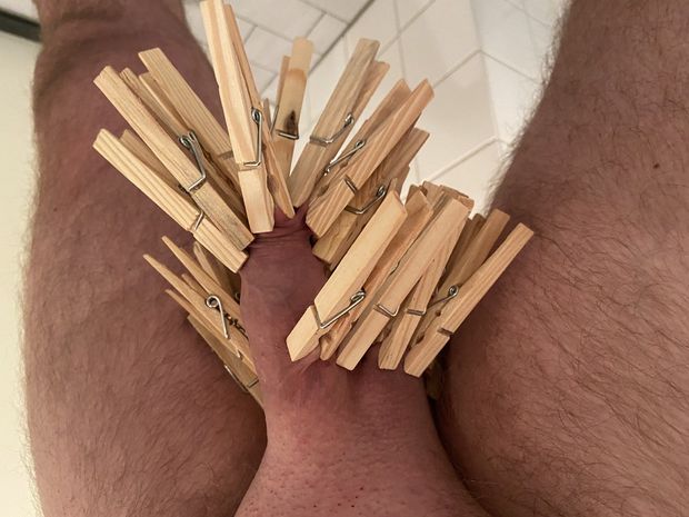 Massive amount of clothespins on penis and balls