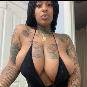 Showing off her Tattoos and her Beautiful Cleavage