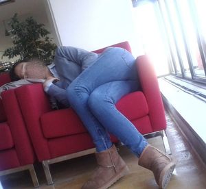 Teen sleeps on chair