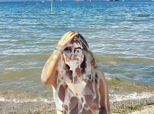 Valeria Soledad Moncada enjoys a massive bukkake facial out by the beach