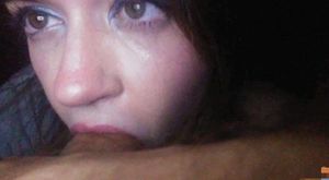 Close up of a hazel-eyed chick with a mouth full of dick