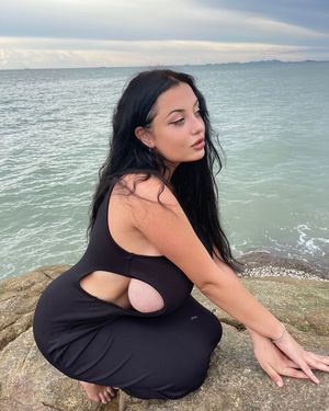 Crouched Down On A Rock