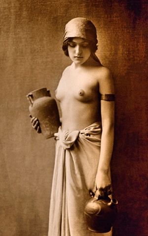 Natalya dressed in slutty wrap as she serves in a speakeasy bar of the 1920s