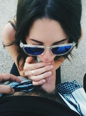 Amateur brunette in sunglasses giving some head outside