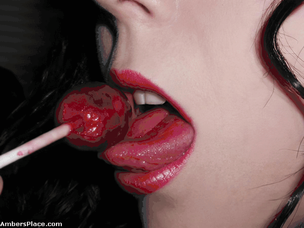 She has her own way of enjoying a lollipop