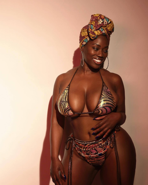 Dark skinned beauty looking like a goddess in her bikini