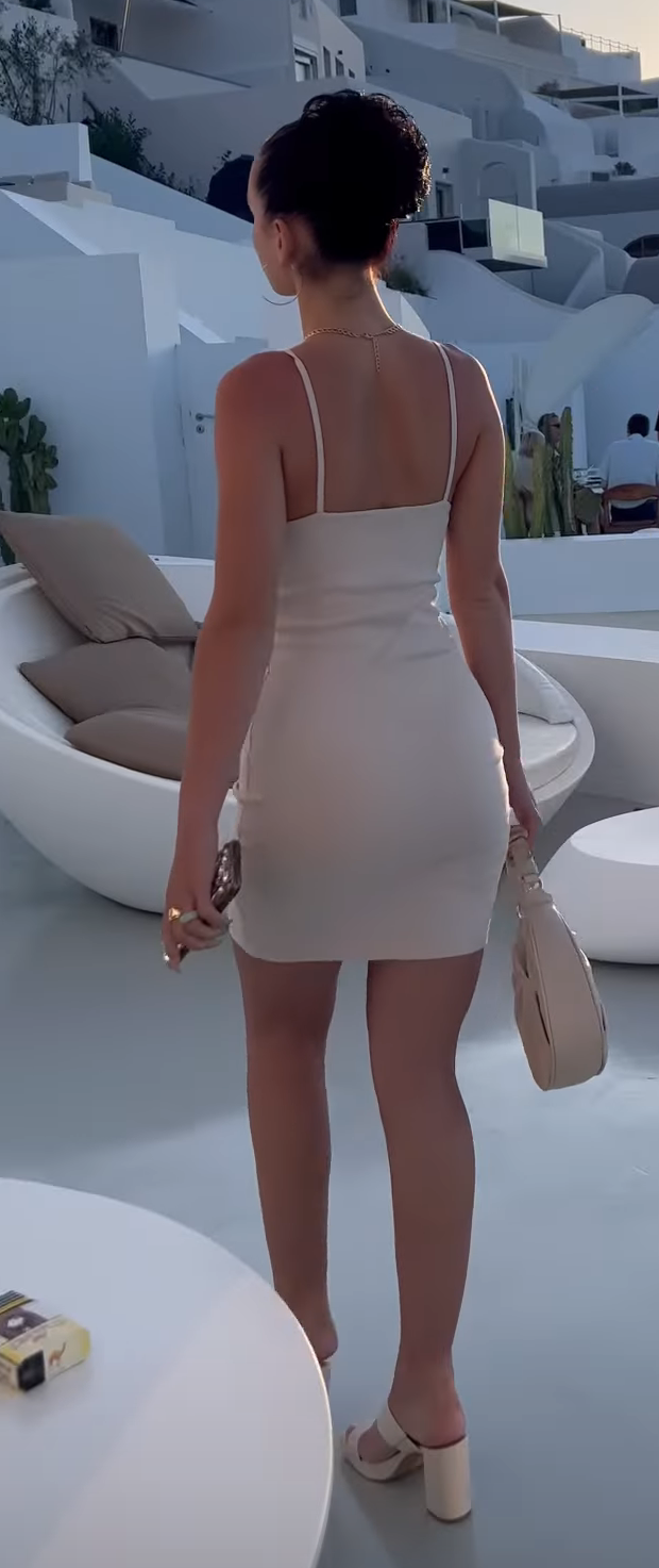 Italian teen girlfriend with tight dress showing her round ass . Rate her and share