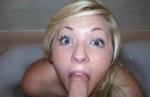 Amateur blond teen in a tub sucking dick