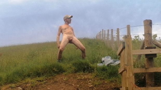 Naked male outdoors in public area