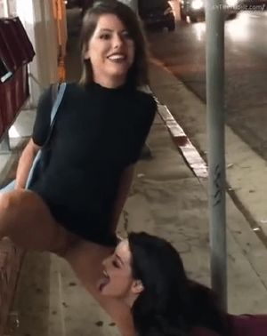 Adriana pissing on sidewalk with Kissa