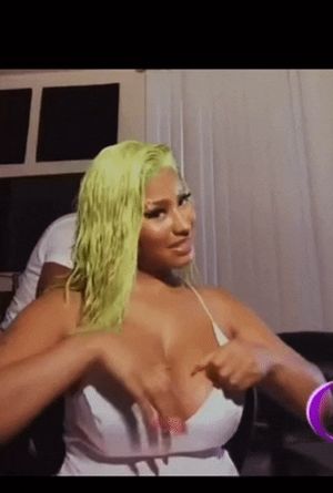 Nicki Minaj playing with her titties