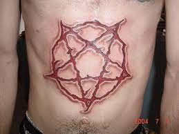 SATAN-carved on him forever