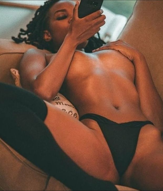 Cute Black woman with cell phone