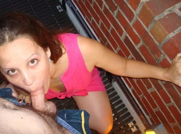 Amateur brunette giving a blowjob outside