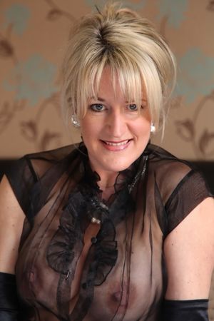 MILF showing off her boobs.