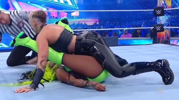 Rhea Ripley with the suggestive pin on Naomi