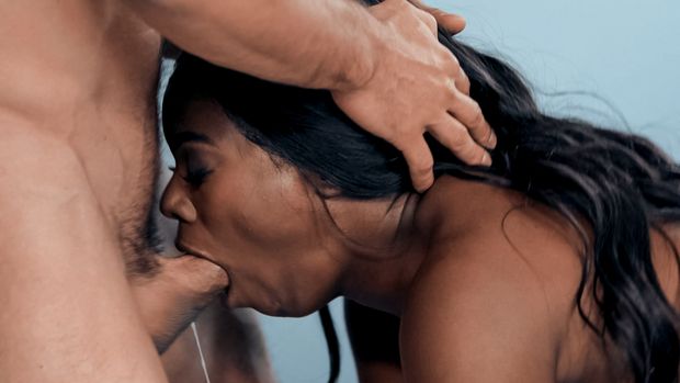 Ebony babe throats white cock.
