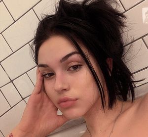 Lying on the bed, her ass bulging, she received one volley of cum after another from the nerds who had to do her homework