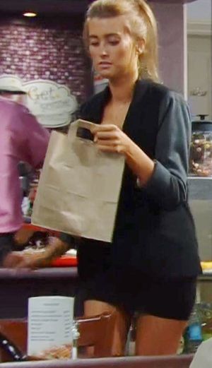 Emmerdale's Debbie Dingle - black business suit & having breakfast in cafe!