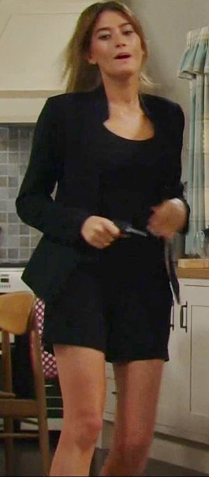 UK Emmerdale's actress hot black business suit & sexy legs