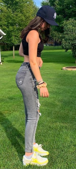 Teen in tight jeans ass side view