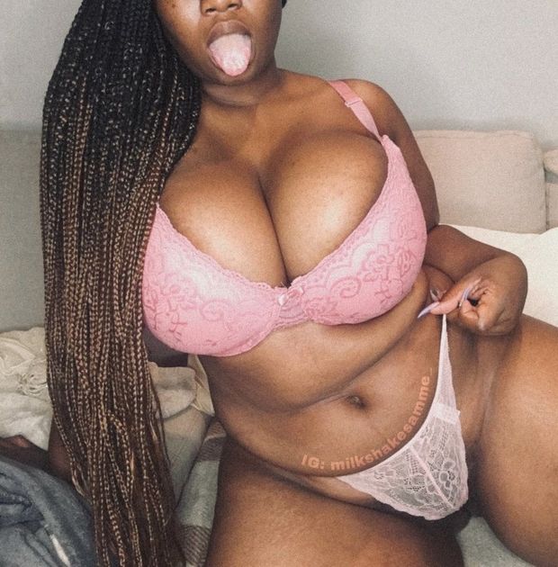 Milkshake Samme in a Pink bra and thong with her tongue out