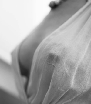 The morning breeze caused her nipples to stiffen as she thought about the pleasures of the night before.