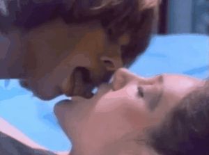 Retro brunette and blonde kissing and rubbing tits