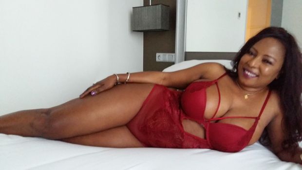 Ndey in red bodystocking, ready to play