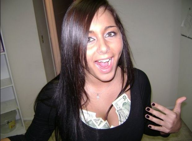 Money on her boobs.