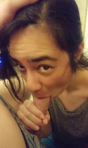 Cute amateur brunette sucking on cock