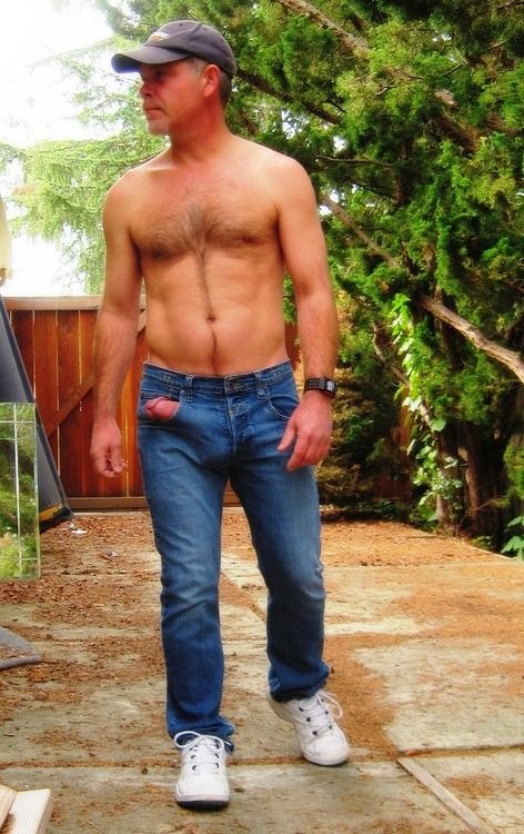 Hot guy with his boner sticking out of his jeans pocket!