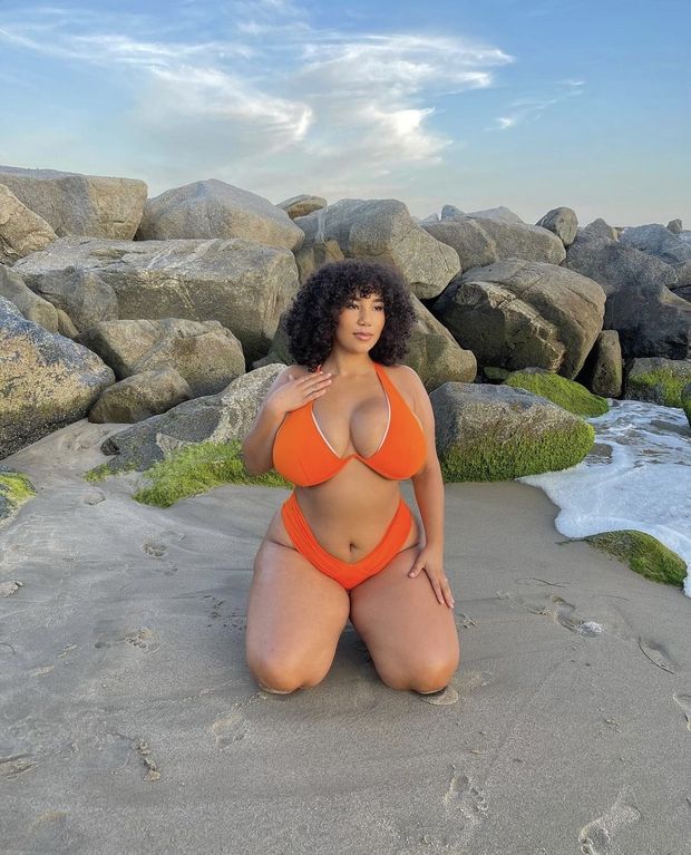 Katelyn Sade looking cute and busty in her Orange bikini