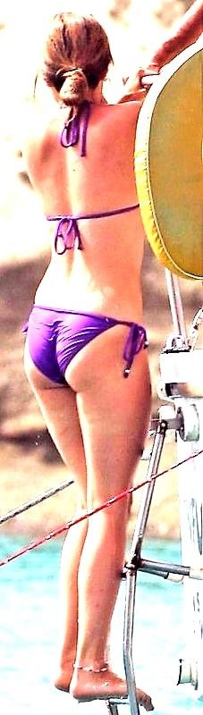 Tina O'Brien purple bikini at beach