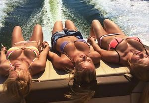 Amazing boobs on blonde laying on boat