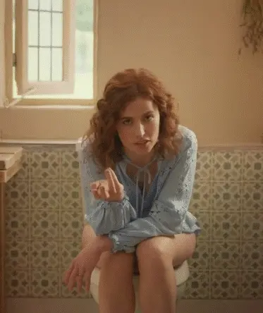 Redhead woman (Lisa O'Connor) sitting on the toilet without pants for a commercial. Slut, what you don't do to make money - Tena Discreet