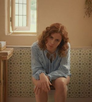 Redhead woman (Lisa O'Connor) sitting on the toilet without pants for a commercial. Slut, what you don't do to make money - Tena Discreet