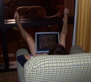 Wife masturbating to bondage porn in hotel window.