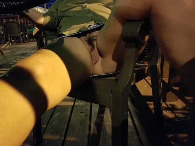 Wife's pussy on patio of bar.